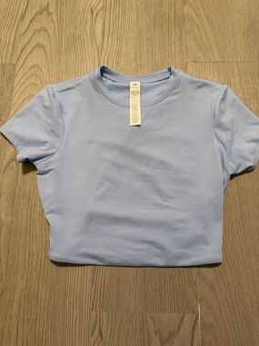 ALO Yoga Women’s Crew Crop Tee in Pale Blue